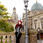 First pic of Clothed redhead Lara Larsen models latex attire and high heels in public