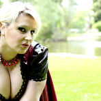 Fourth pic of Overweight blonde Darkwing Zero models on a lawn in a rubber dress