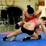 Second pic of Sporty chicks fight on a wrestling floor for a lesbian domination