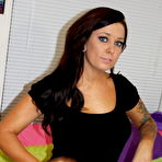 First pic of Tattooed brunette Lilly works her tits and pussy free of a little black dress