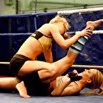 Second pic of Pretty lesbians gasping and stripping each other in the wrestling ring