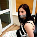Fourth pic of Brunette female Randy Star is silenced with duct tape while tied up with rope