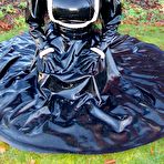 Second pic of Solo model Lady Angelina smokes while exposing herself in a rubber uniform