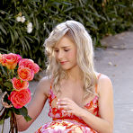 Second pic of Young beauty Kara Duhe stops to smell the flowers & toy in naked upskirt