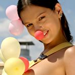 Second pic of Beautiful girl Sweet Eva gets naked while blowing up balloons on a patio