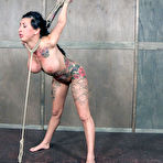 Fourth pic of Tattooed female Lily Lane endures being tortured in a dungeon as best she can