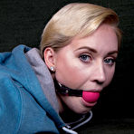 Fourth pic of Short haired blonde is left ball gagged and hogtied in sweats and a hoodie