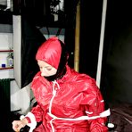 Second pic of Amateur model Pia is tied to a hairdresser chair in a raincoat while gagged