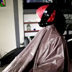 Fourth pic of Amateur model Pia is tied to a hairdresser chair in a raincoat while gagged