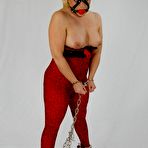 Third pic of Thick blonde is kept in chains and a ball gag until it's time to suck cock