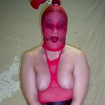 Third pic of Caucasian plumper is subjected to breath play while topless and restrained