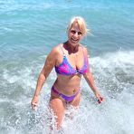 Second pic of Middle-aged blonde Sweet Susi releases her natural tits and twat from a bikini