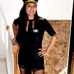 First pic of 30 plus Latina chick Julie Ann peels off pilot uniform to pose nude in hosiery