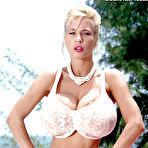 First pic of Stocking clad MILF pornstar Tiffany Towers baring monster tits outdoors