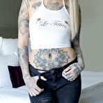 First pic of Tattooed girl Leigh Raven wears a black choker while getting naked