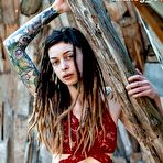 First pic of Tattooed female Cutz sports dreadlocks while showing her tiny tits