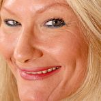 First pic of Granny blonde Roxy is demonstrating her naked pussy and boobies