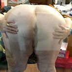 Fourth pic of Fat nan with short red hair presses her big boobs and butt up against glass