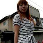 Second pic of Asian Chihiro Ozawa is walking in her sexy striped dress outdoors