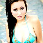 Second pic of Asian brunette Krista Kim poses wet in her sexy bikini at the pool