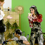 Third pic of European fetish ladies make some fully clothed foodplay action