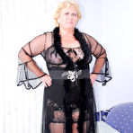 First pic of Fat nan Fanny frees her big butt and vagina from black lingerie in stockings