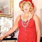 First pic of Mature amateur DirtyDoctor pulls her bare tits out of her red dress