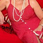 Second pic of Mature amateur DirtyDoctor pulls her bare tits out of her red dress