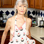 Second pic of Old woman Linda Jones exposes her wrinkly body while cleaning her kitchen