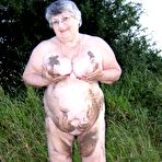 Fourth pic of Fat nan Grandma Libby steps into a puddle before covering herself in mud