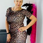 First pic of Old woman Savana doffs an animal print dress to pose nude in stockings & boots