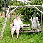 First pic of Old British woman Grandma Libby exposes her boobs on a backyard bench swing