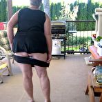 Second pic of Old lady Girdle Goddess shakes her big butt while on a veranda