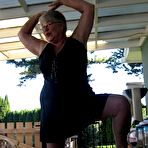 Third pic of Old lady Girdle Goddess shakes her big butt while on a veranda