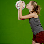 Second pic of Petite girl Kelly exposes a breast while holding a soccer ball