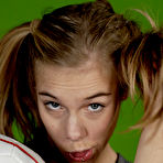 Third pic of Petite girl Kelly exposes a breast while holding a soccer ball