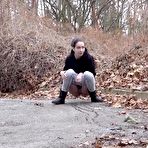 Third pic of Nice girl Mistica pulls down her pants to pee on a road less traveled by