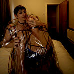 Third pic of Molly MILF and her lesbian lover fondle each other in clear plastic raincoats