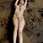 Third pic of Naked teen Keira Blue models for a solo shoot on wet sand in a sea cave