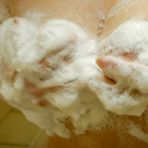 Second pic of Sassy asian mature lady with unshaven pussy and nice tits taking shower