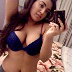 Third pic of Busty Indian girl with long hair changes her bras during self shots - NakedPics