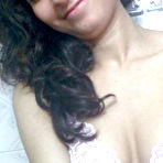 Second pic of Indian solo girl holds her face firm while letting nipples free of lingerie - NakedPics