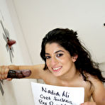 Fourth pic of Clothed Indian Nadia Ali gets naked after finding a BBC poking thru gloryhole - NakedPics