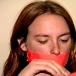 Third pic of tied-and-gagged.com | 24 Yr OLD CRAFTER IS  CLEAVE GAGGED, TIES HERSELF WITH TAPE, STUFFS HER OWN MOUTH, TAPE GAGS HERSELF, HANDCUFFS HERSELF, IS HANDGAGGED WHILE WEARING A SEXY BIKINI (D73-4)