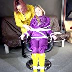 Fourth pic of Shinynylonartsbound | Watching sexy Sandra wearing hot purple shiny nylon rainwear with rubber boots being tied, gagged and hooded from Stella wearing a sexy yellow shiny nylon rainwear with high heels rubber boots (Video)