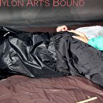 Fourth pic of Shinynylonartsbound | SEXY RONJA being overhelmed, tied and gagged from Stella with ropes and a ballgag on a sofa both wearing shiny nylon rainwear (Pics) Part 2